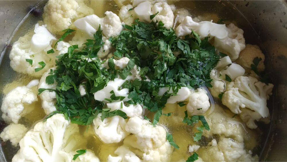 cauliflower and chopped parsley added to the broth inside instant pot
