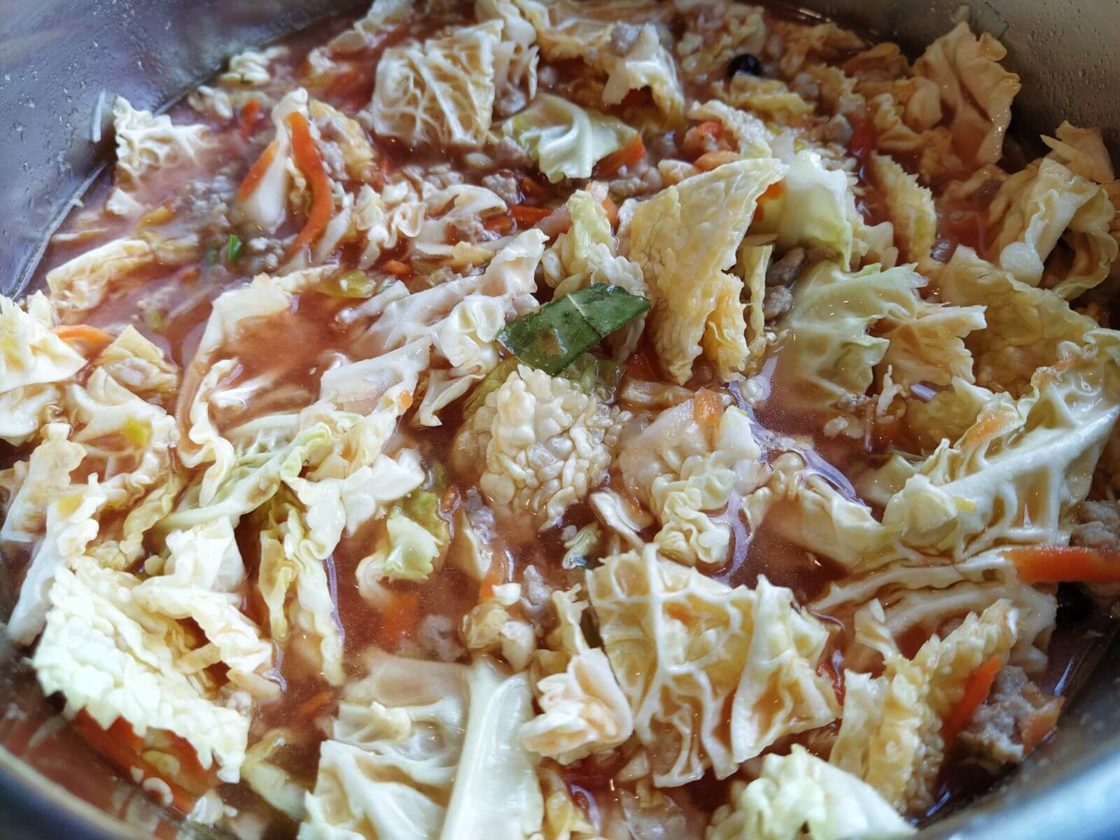 all ingredients for cabbage soup mixed inside instant pot