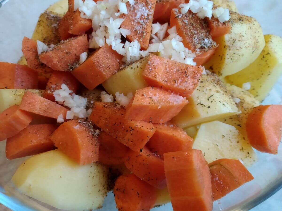 chopped carrots and potatoes withs onion and herbs